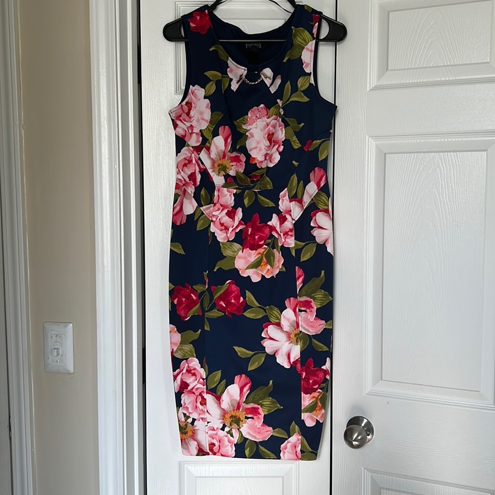 True to size. Feels more like a body con dress.